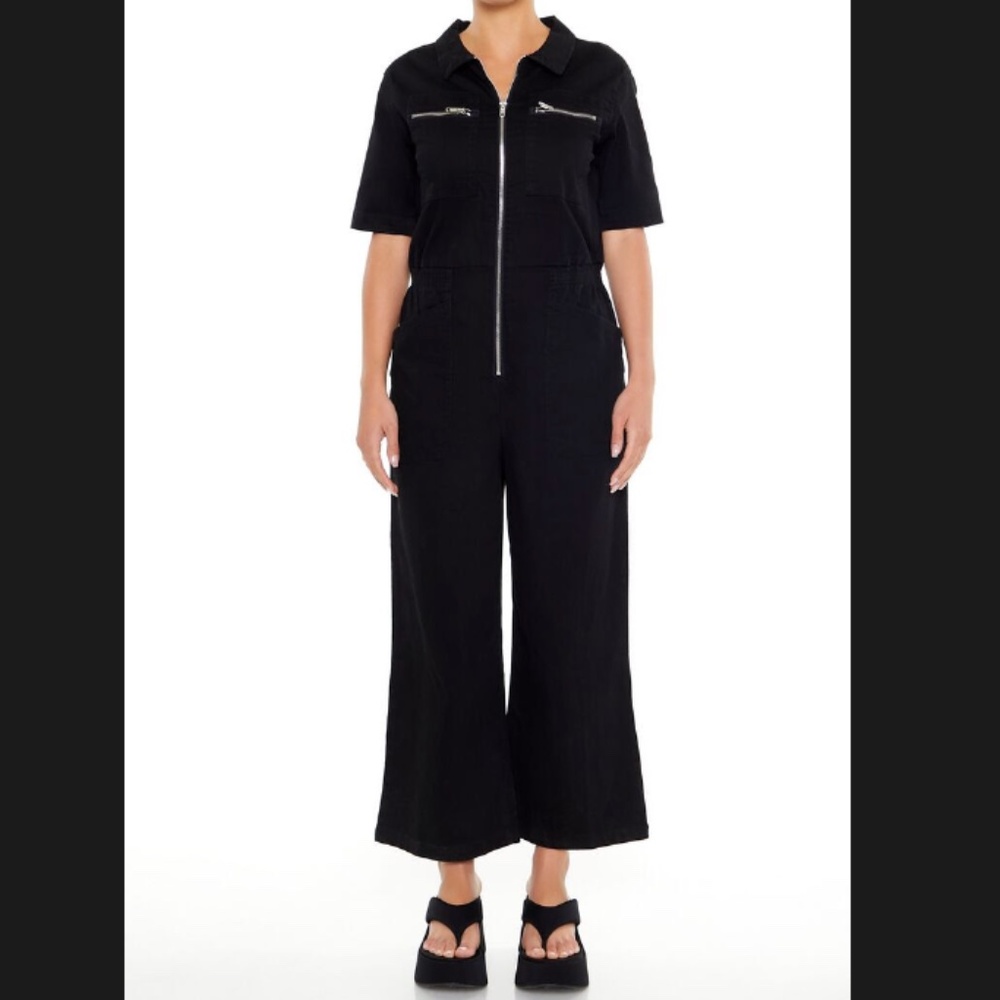 Black coveralls w/ zip front.